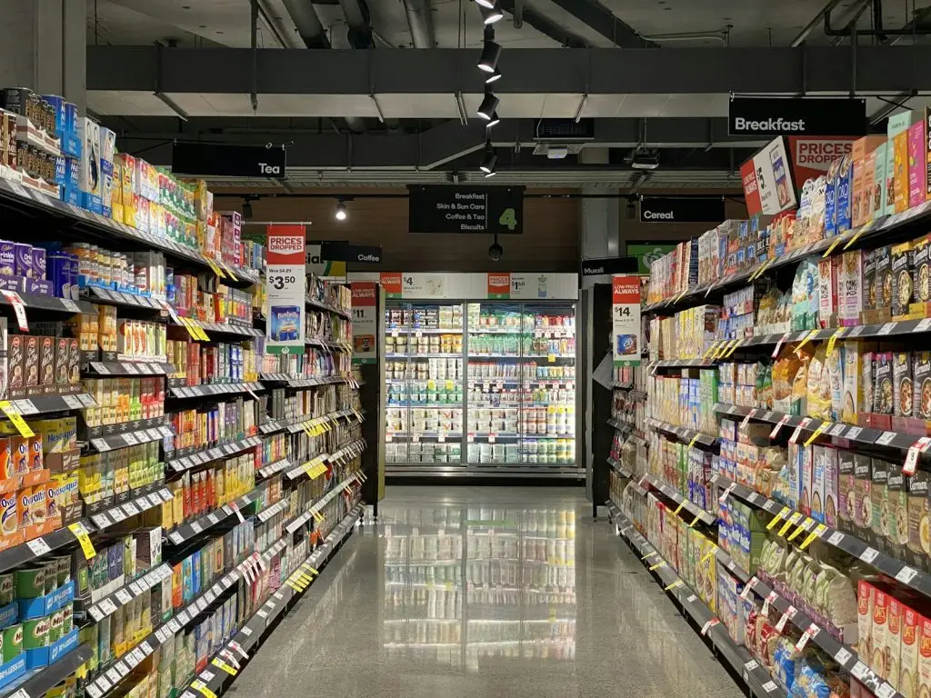 Well-stocked convenience store aisle with snacks, drinks and everyday essentials in Canberra CBD